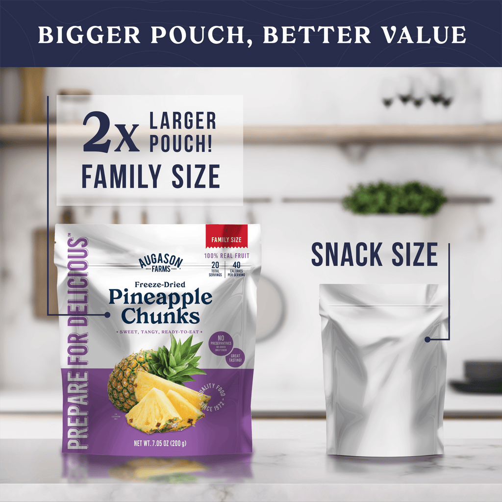 A large Augason Farms Freeze Dried Pineapple Chunks Family Size Pouch (20 servings) is shown beside a smaller unlabeled pouch, highlighting the 2x larger family size packed with 100% real freeze dried pineapple.
